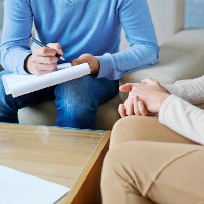 Counseling and Psychotherapy. Image: counselor and patient in session.