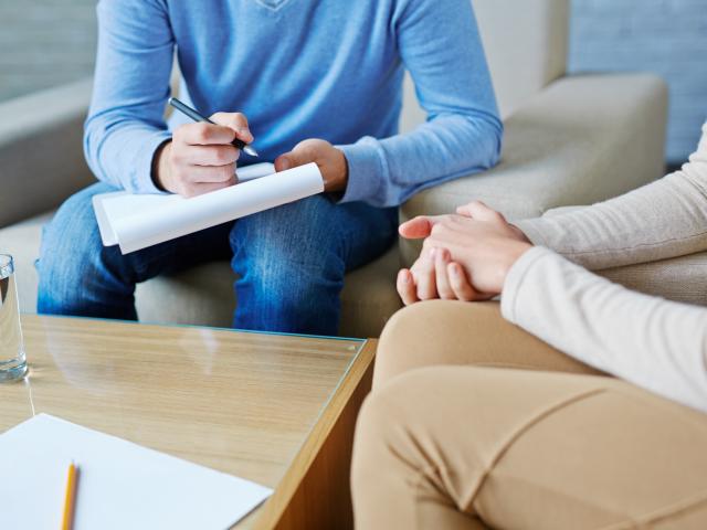 Counseling and Psychotherapy. Image: counselor and patient in session.